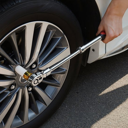 Homme utilise clé à cliquet pour installer pneus