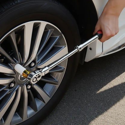 Homme utilise clé à cliquet pour installer pneus