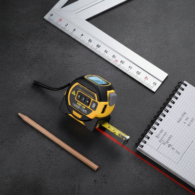 Metre ruban laser sur plancher béton noir