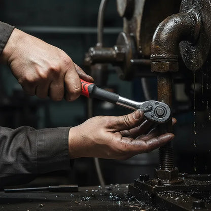 Technicien répare tuyauterie industrielle avec coffret à douilles